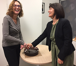 Karen and Sylvia cutting the cake